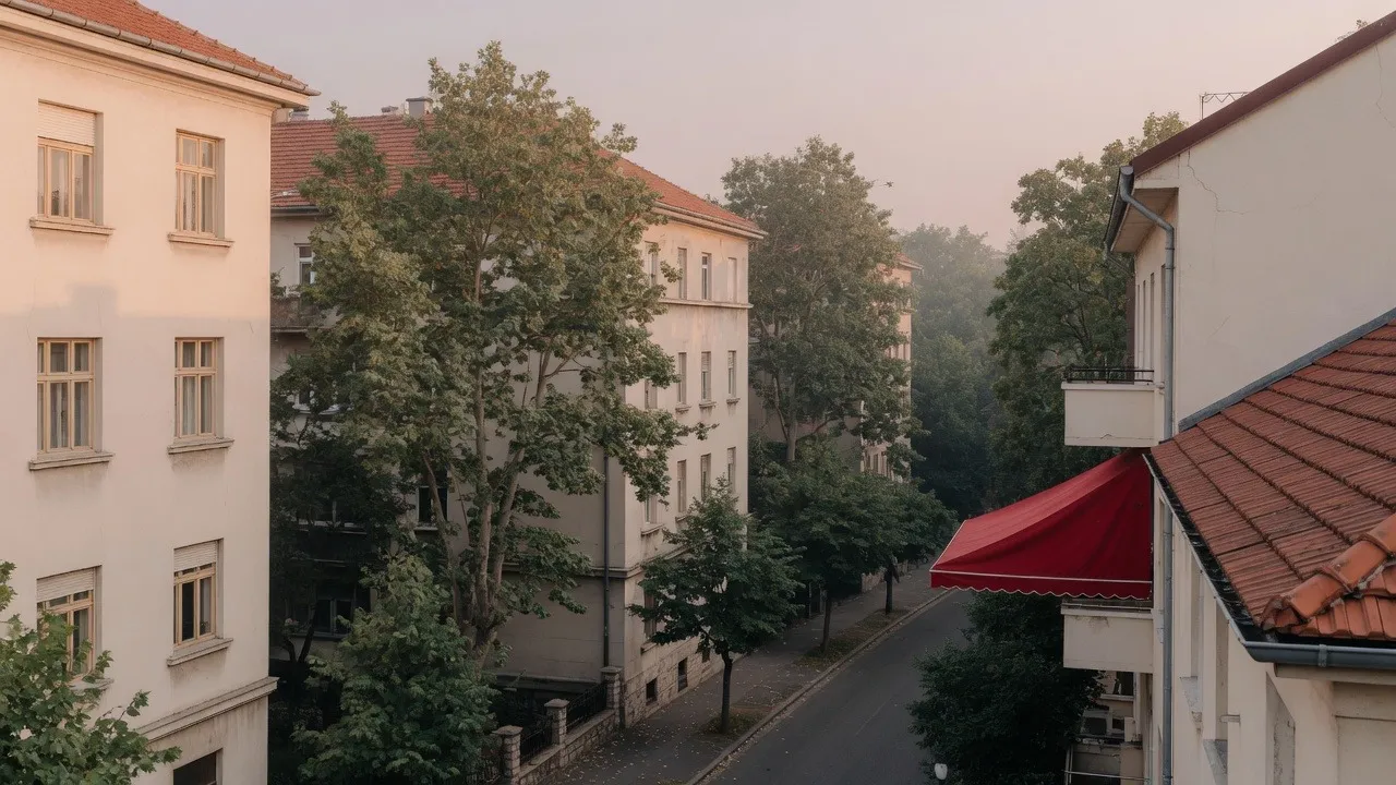 Sunlit Belgrade street with classic facades and trees
